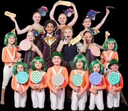Students in colourful candy-themed musical theatre costumes